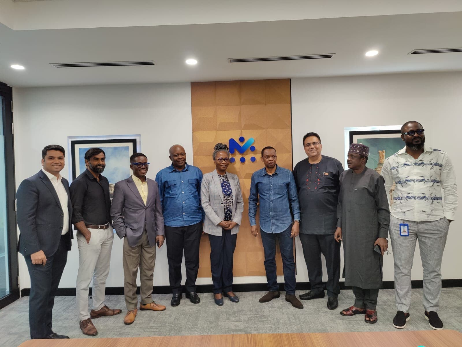 Group photo of NCC and 3R delegates inside a Mobileum conference room