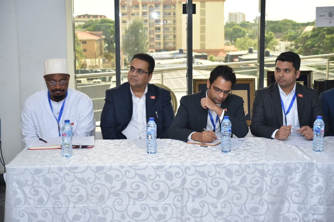 3R Consortium representatives seated at the boardroom table taking notes