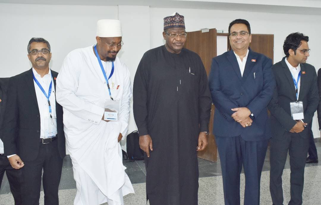 Professor Umar Danbatta, then Executive Vice Chairman of NCC, at the centre of a delegation group portrait