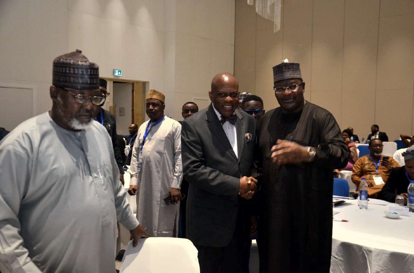 A handshake between senior delegates at the workshop
